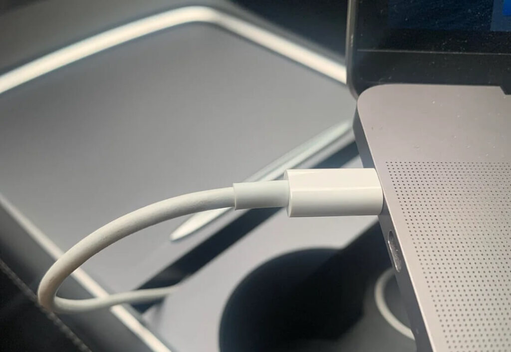 Macbook Charging In Tesla